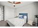 Cozy bedroom with blue accents, carpet, and a ceiling fan at 2688 Loon Cir, Castle Rock, CO 80104