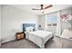 Cozy bedroom with blue accents, carpet, and a ceiling fan at 2688 Loon Cir, Castle Rock, CO 80104