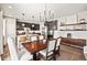 Open concept kitchen with dark cabinets, granite countertops, and a large kitchen island at 2688 Loon Cir, Castle Rock, CO 80104