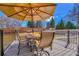 Outdoor patio with seating and shade, perfect for entertaining and outdoor dining at 3680 S Glencoe St, Denver, CO 80237