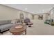 Spacious finished basement area with modern seating, open layout and recreation areas at 3680 S Glencoe St, Denver, CO 80237