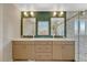 Bathroom boasts dual sinks, a vanity, and custom tile work at 3680 S Glencoe St, Denver, CO 80237