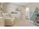 Well-decorated Bedroom room with a cozy rocking chair and mountain wall decor at 3680 S Glencoe St, Denver, CO 80237