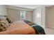 Bedroom featuring large windows, neutral paint, and closet at 3680 S Glencoe St, Denver, CO 80237