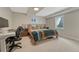 Bedroom featuring large windows, a desk and chair, and neutral paint at 3680 S Glencoe St, Denver, CO 80237