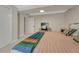 Bedroom with neutral paint and a door that leads to a hallway at 3680 S Glencoe St, Denver, CO 80237