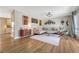 Bright living room featuring hardwood floors, a sectional sofa, and contemporary decor for comfortable living at 3680 S Glencoe St, Denver, CO 80237