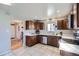 Open kitchen featuring stainless steel appliances and hardwood floors at 7217 Huron St, Denver, CO 80221