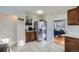 Well-organized kitchen area with stainless steel refrigerator and bright, tiled flooring at 7217 Huron St, Denver, CO 80221