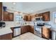 Efficient kitchen with stainless steel appliances and ample countertop space at 7217 Huron St, Denver, CO 80221