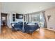 Bright living room with fireplace, built-ins, and hardwood floors at 7217 Huron St, Denver, CO 80221