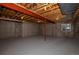 Unfinished basement space with exposed ceiling and concrete walls ready for customization and creative design at 40477 Ferns Rd, Elizabeth, CO 80107