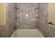 Bathroom featuring a bath and built in shelving at 40477 Ferns Rd, Elizabeth, CO 80107