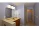 Bathroom featuring a bath, sink, and a large mirror at 40477 Ferns Rd, Elizabeth, CO 80107