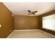 Cozy bedroom with carpeted floors, a ceiling fan, and a window with plenty of natural light at 40477 Ferns Rd, Elizabeth, CO 80107
