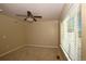 Cozy bedroom with carpet, large window, and ceiling fan at 40477 Ferns Rd, Elizabeth, CO 80107