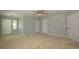 Bright bedroom with neutral carpet, ceiling fan, and multiple doors at 40477 Ferns Rd, Elizabeth, CO 80107