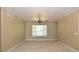 Neutral-toned bedroom featuring a ceiling fan and large window at 40477 Ferns Rd, Elizabeth, CO 80107