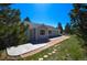 Exterior angle of light blue ranch home showing the front door and a concrete patio at 40477 Ferns Rd, Elizabeth, CO 80107