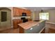 Bright eat-in kitchen featuring granite countertops, sleek appliances, and a large window at 40477 Ferns Rd, Elizabeth, CO 80107