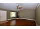 Bright living room featuring wood floors, a wood-burning stove, and natural light at 40477 Ferns Rd, Elizabeth, CO 80107