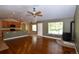 Open-concept living area connects to kitchen, features a wood-burning stove, and views of the yard at 40477 Ferns Rd, Elizabeth, CO 80107