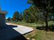 View of backyard from patio with green grass and mature trees adding privacy at 40477 Ferns Rd, Elizabeth, CO 80107