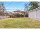 Backyard showcasing large grassy area, and a detached garage at 1030 Krameria St, Denver, CO 80220