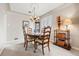 Dining room featuring hardwood table, neutral color palette, and natural light at 1030 Krameria St, Denver, CO 80220