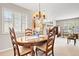 Dining room with natural light, hardwood table and neutral color palette at 1030 Krameria St, Denver, CO 80220