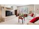 Bright living room featuring a brick fireplace, large windows with shutters, and comfortable furniture at 1030 Krameria St, Denver, CO 80220