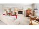 Cozy living room features a brick fireplace, plush seating, and a dining set for gatherings and relaxation at 1030 Krameria St, Denver, CO 80220