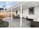 Covered back patio with seating area, providing a relaxing outdoor space at 1615 S Elizabeth St, Denver, CO 80210