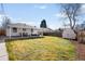 Expansive backyard featuring a well-kept lawn, patio, and storage shed at 1615 S Elizabeth St, Denver, CO 80210