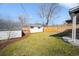 Private backyard with green lawn, shed, and wooden fence at 1615 S Elizabeth St, Denver, CO 80210
