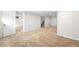 Finished basement area with neutral carpet, white trim, and access to additional rooms and storage at 1615 S Elizabeth St, Denver, CO 80210