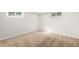 This carpeted room in the basement features natural light from a window at 1615 S Elizabeth St, Denver, CO 80210
