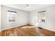Bright bedroom with hardwood floors, neutral walls, and natural light from the dual windows at 1615 S Elizabeth St, Denver, CO 80210