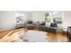Bright living room with hardwood floors, large windows, and contemporary furniture at 1615 S Elizabeth St, Denver, CO 80210