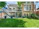 Spacious backyard with a deck, patio, green lawn and professional landscaping at 11453 E Orchard Pl, Englewood, CO 80111