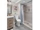 Updated bathroom featuring tiled shower, modern vanity and fixtures, and decorative artwork at 11453 E Orchard Pl, Englewood, CO 80111