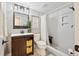 Modern bathroom with white tile shower, updated vanity, and contemporary fixtures at 11453 E Orchard Pl, Englewood, CO 80111