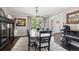 Stylish dining room with ample seating, elegant decor, and natural light creates a warm and inviting space for meals at 11453 E Orchard Pl, Englewood, CO 80111