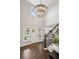 Grand entryway featuring soaring ceilings, elegant chandelier, hardwood floors, and staircase, creating a welcoming ambiance at 11453 E Orchard Pl, Englewood, CO 80111