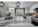 Spacious kitchen with granite counters, custom cabinets, and modern fixtures at 11453 E Orchard Pl, Englewood, CO 80111