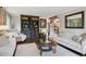 Elegant living room with hardwood floors, decorative accents, and a cozy atmosphere perfect for relaxation and entertaining at 11453 E Orchard Pl, Englewood, CO 80111