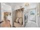 Mudroom with bench and storage, laundry area and entrance to kitchen at 11453 E Orchard Pl, Englewood, CO 80111