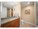 Bright bathroom featuring a double vanity with granite countertop and a glass-enclosed shower at 1411 Wynkoop St # 804, Denver, CO 80202