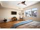 Bedroom featuring a large window with city views and a ceiling fan at 1411 Wynkoop St # 804, Denver, CO 80202