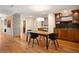 Elegant dining room with a modern table and chairs, custom cabinets, and hardwood flooring at 1411 Wynkoop St # 804, Denver, CO 80202